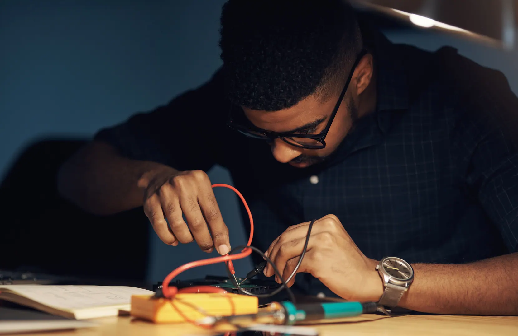 Engineer working with electronic equipment